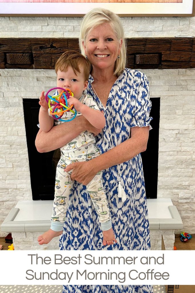 An elderly woman in a blue and white dress holds a toddler in pajamas. The toddler is holding a colorful toy. Text at the bottom reads, "The Best Summer and Sunday Morning Coffee.