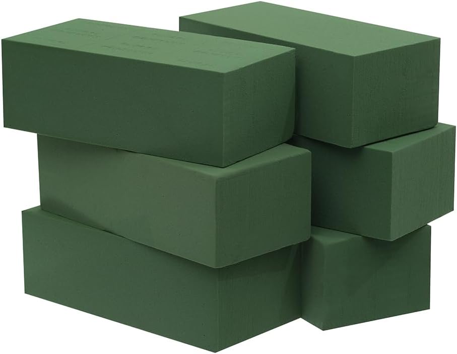 Stack of six green floral foam blocks of varying orientations, with a matte surface, perfect for creating stunning fall flower arrangements.