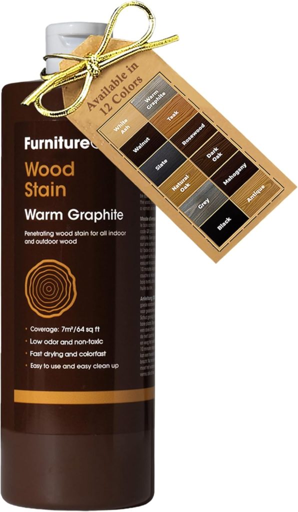 A bottle of wood stain labeled "Warm Graphite," with features listed and a tag showing it is available in 12 colors, sits elegantly adorned with a gold ribbon. Perfect for enhancing your table settings alongside your finest plate chargers.