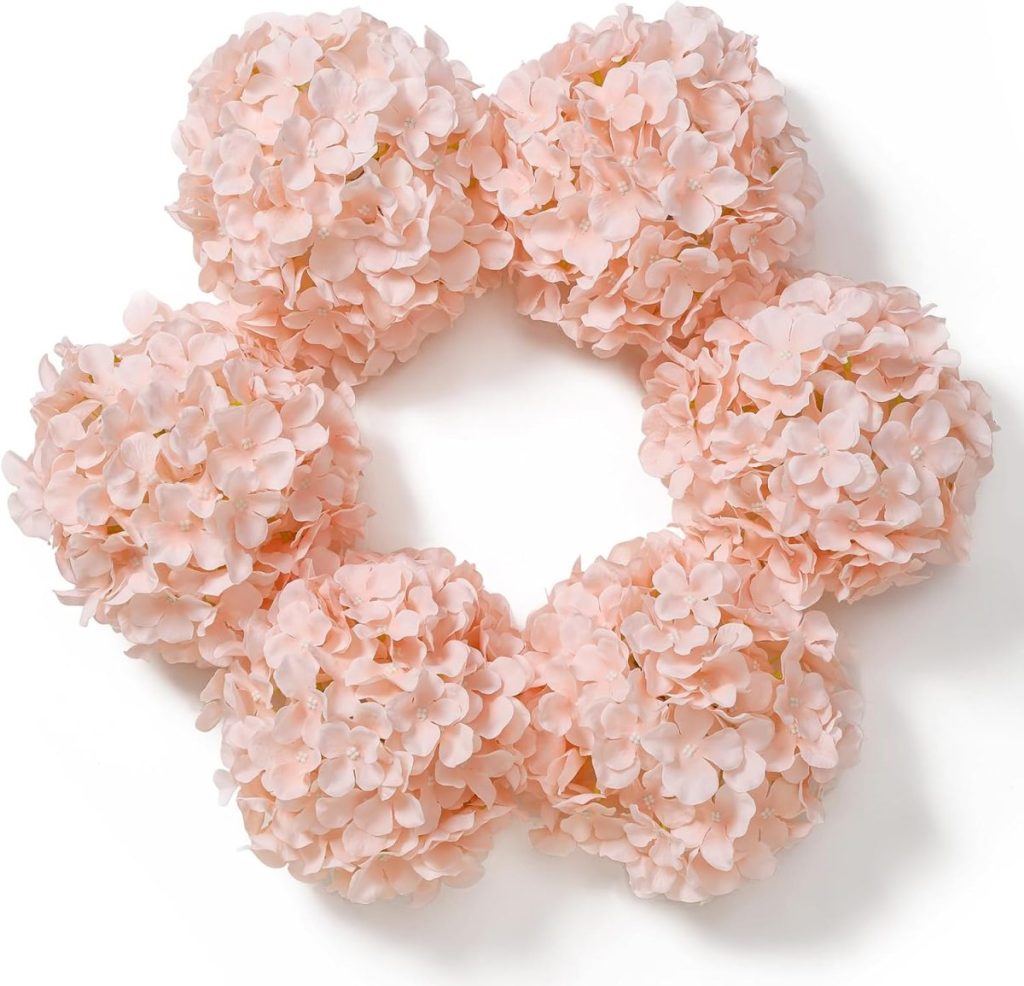 A floral wreath made of six clusters of light pink hydrangea blossoms arranged in a circular shape on a white background, perfect as a centerpiece around wood charger plates.