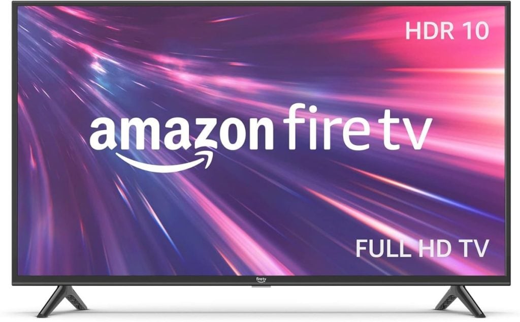 A widescreen TV displaying the "Amazon Fire TV" logo, with "HDR 10" and "Full HD TV" text. The screen shows a dynamic, colorful streak background with shades of purple and pink.