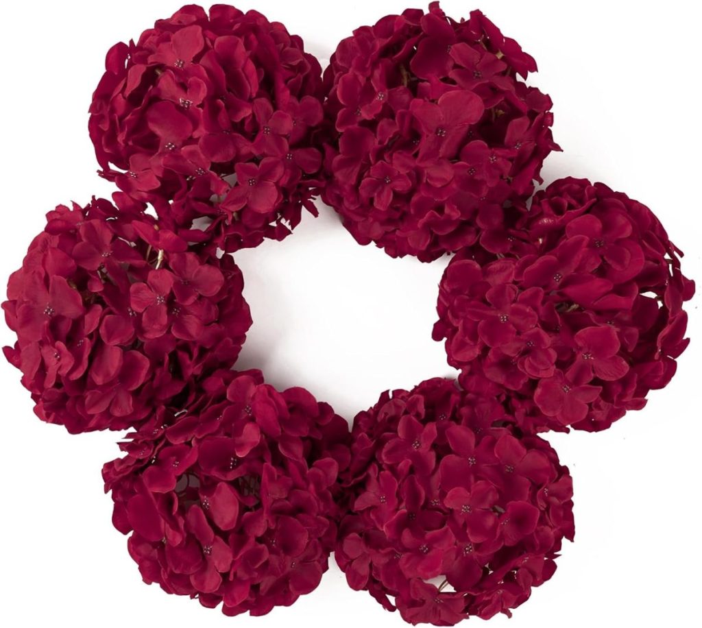 A wreath made of six clusters of dark red hydrangea flowers arranged in a circular pattern against a white background, perfect for displaying on wood charger plates.