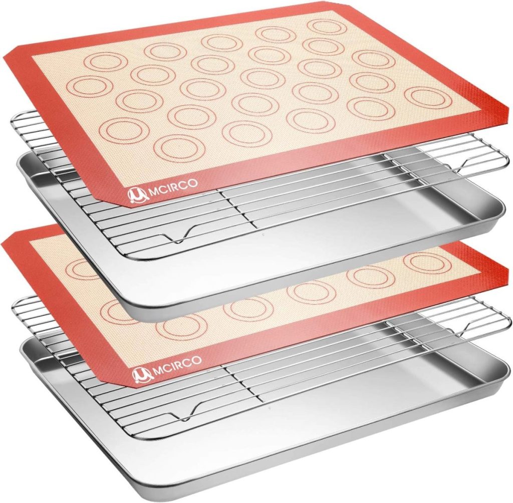 Stacked baking sheets with wire racks and silicone mats featuring circular patterns, perfect for baking Halloween Sugar Cookies, branded with MCIRCO, shown on a white background.