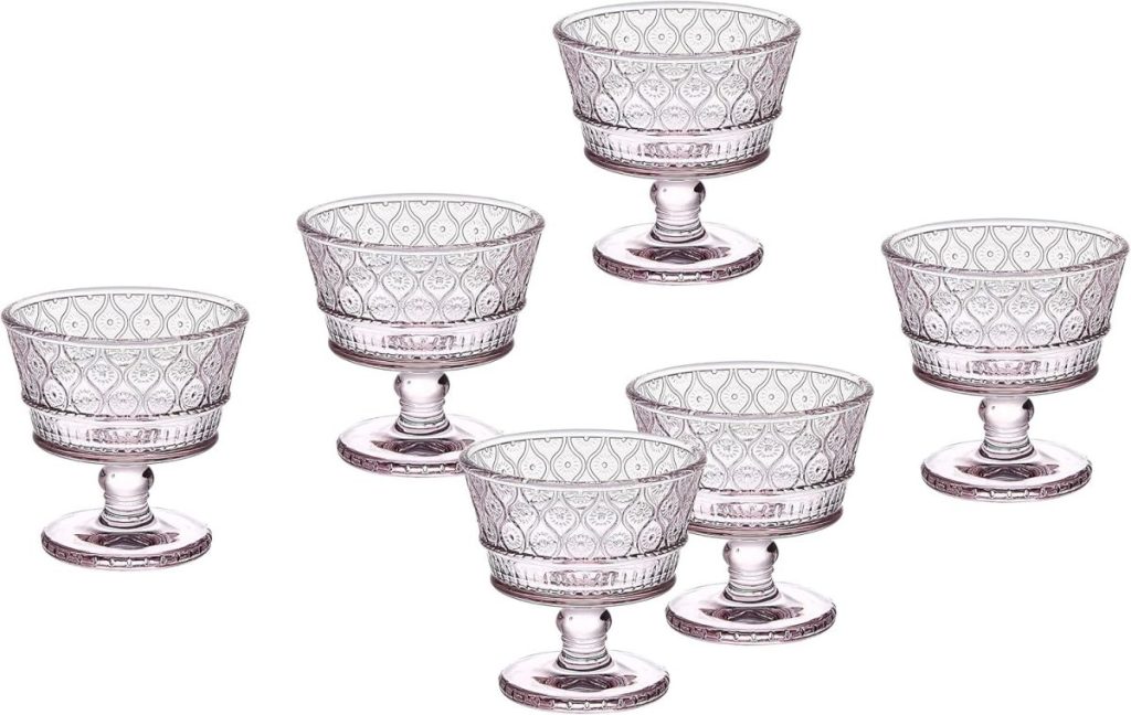 Six vintage-style, clear glass dessert cups with short stems—perfect for serving pumpkin spice latte-inspired treats—are arranged in two rows on a white background.