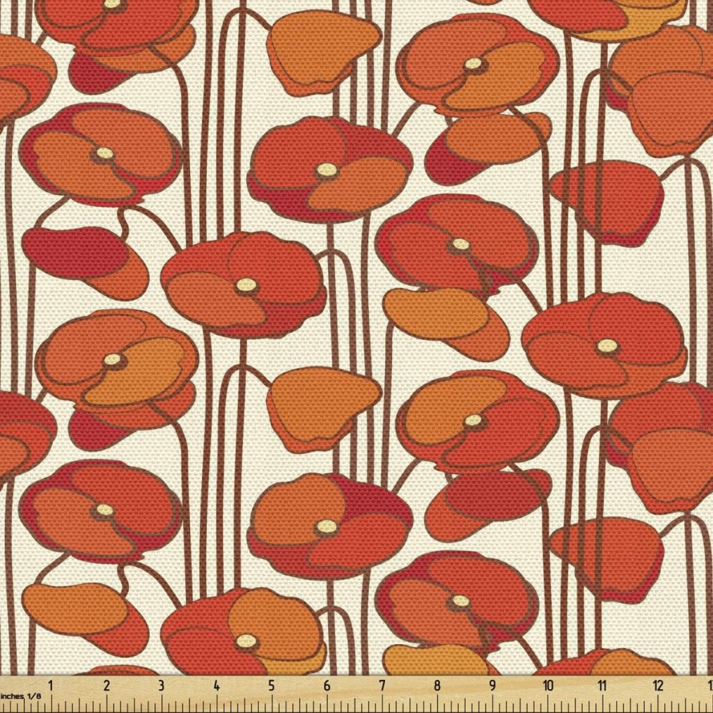 A patterned fabric featuring stylized red and orange poppy flowers with long stems on a beige background, accented by subtle fall pumpkins; a ruler at the bottom shows scale in inches.