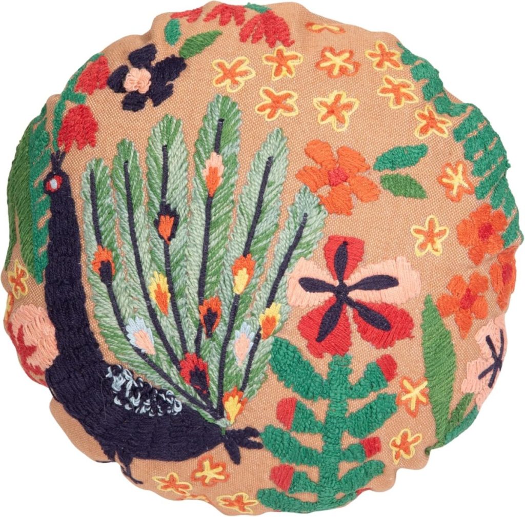 Round cushion with tan fabric, featuring colorful embroidered floral patterns and a peacock design—perfect to complement your Fall Pillow Covers.