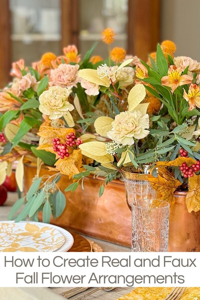 A floral arrangement featuring a mix of real and faux fall flowers in warm tones, with a title text overlay: "How to Create Real and Faux Fall Flower Arrangements".