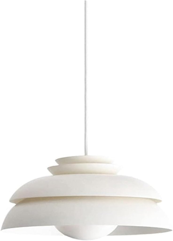 A modern, white, multi-layered pendant light fixture is suspended from the ceiling by a white cord.