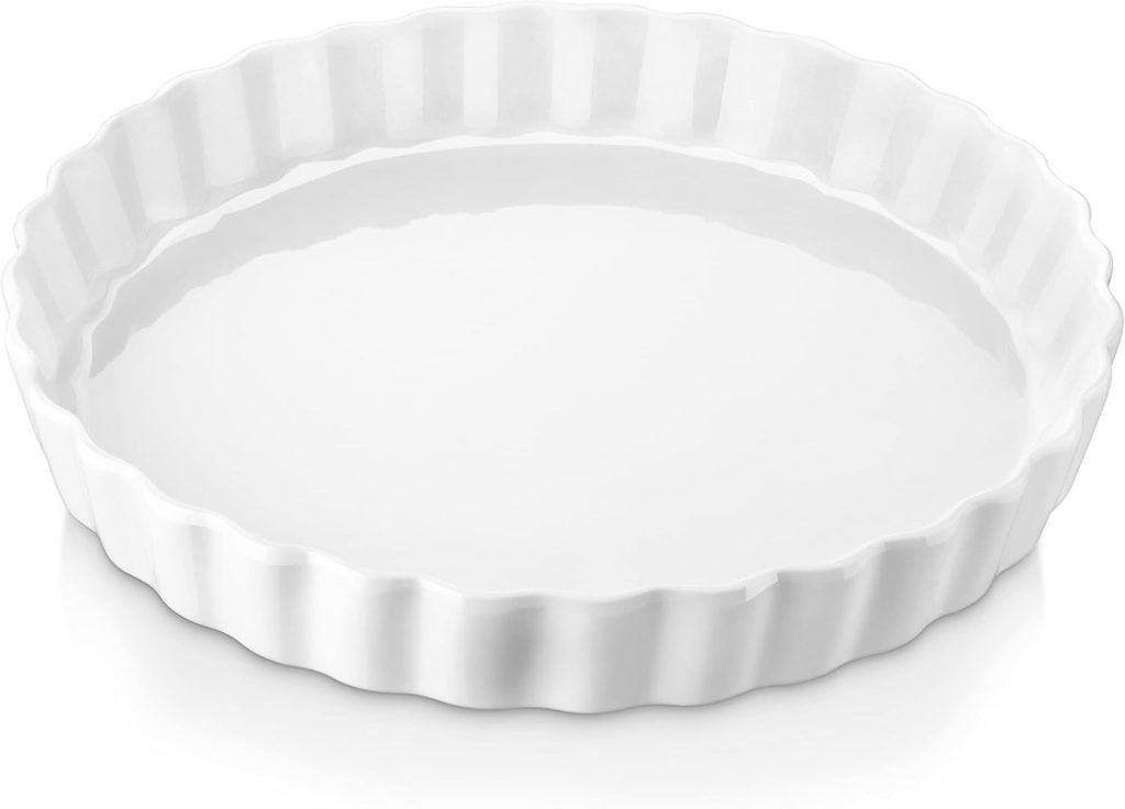 White fluted tart dish with a smooth, glossy finish, perfect for serving pie for breakfast, viewed from above.