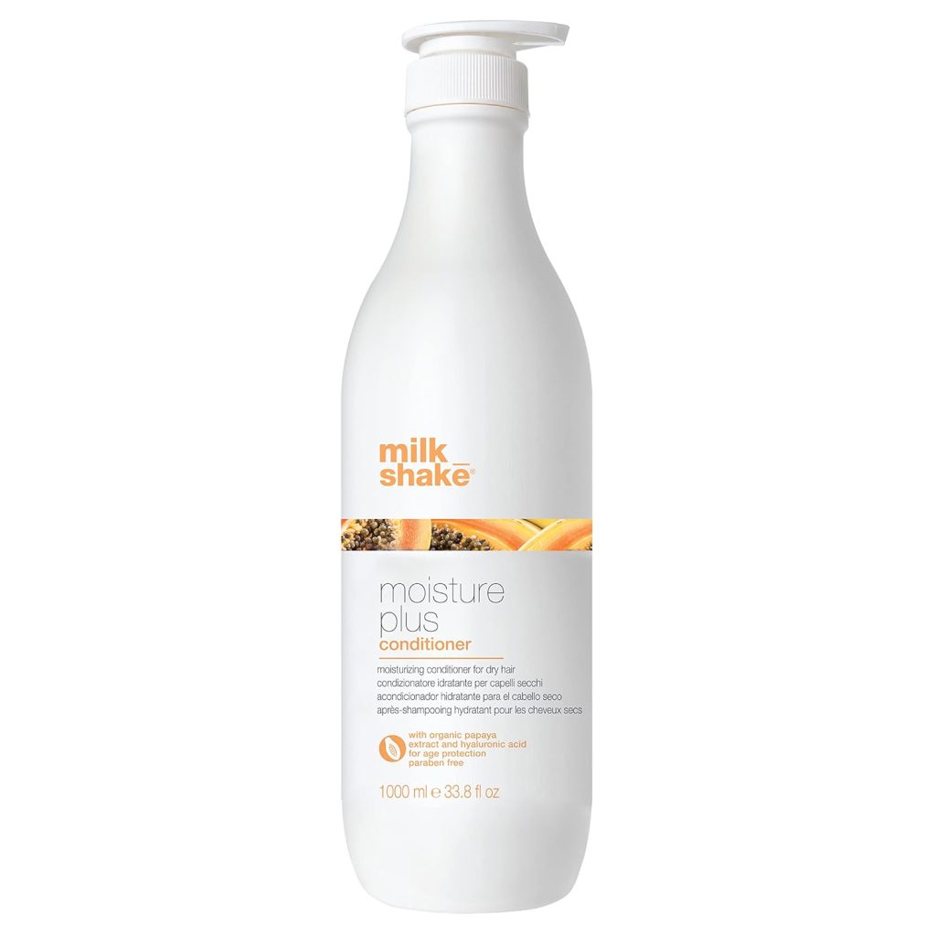 This 1000 ml white bottle of Milk Shake Moisture Plus Conditioner, available with Amazon Prime for swift delivery, features a convenient pump top and vibrant orange branding.