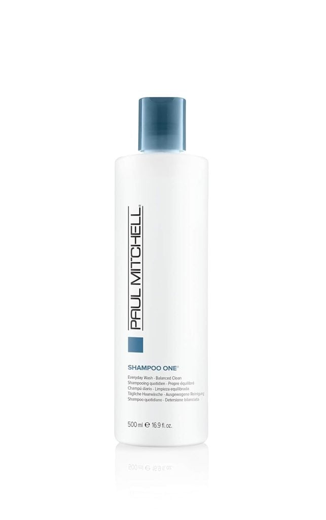 A white bottle of Paul Mitchell Shampoo One, 500 ml, with a blue cap is available for swift delivery through Amazon Prime.