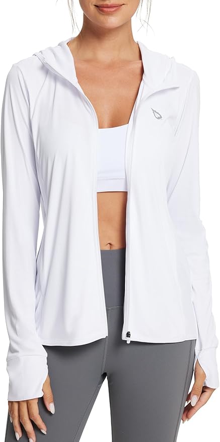 A person wearing a white athletic hoodie over a sports bra and gray leggings.