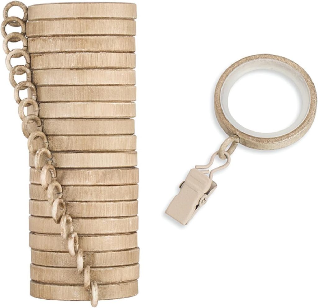 A stack of metal key rings linked together on the left, with a single key ring and clasp attachment on the right, styled in a Serena and Lily-inspired aesthetic against a white background.