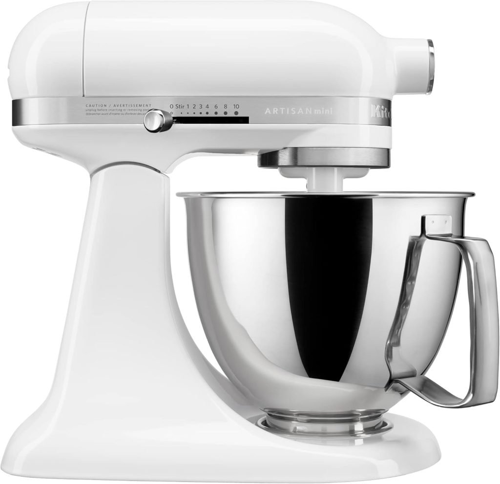 This elegant white stand mixer, perfect for an Airbnb kitchen in Waco, features a gleaming silver mixing bowl and a convenient speed control dial on the side.