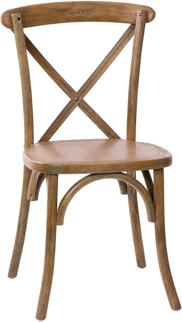 This charming wooden dining chair, perfect for your Airbnb in Waco, features an X-shaped backrest and elegantly curved legs.