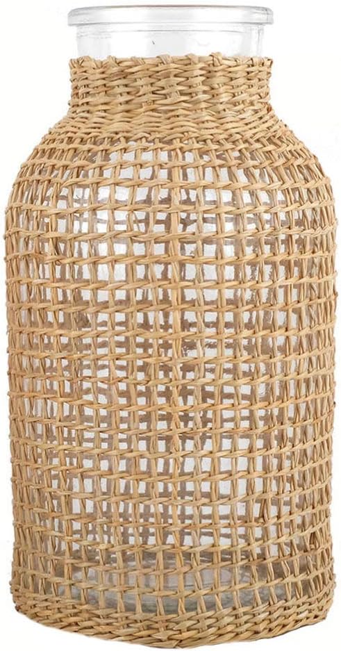 Clear glass jar encased in a woven wicker cover.