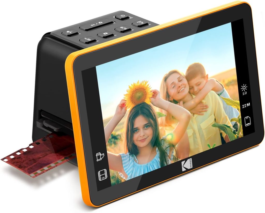 A digital photo scanner, available with Amazon Prime, showcases a screen with three smiling children, one holding a sunflower. A film strip is partially inserted into the device.