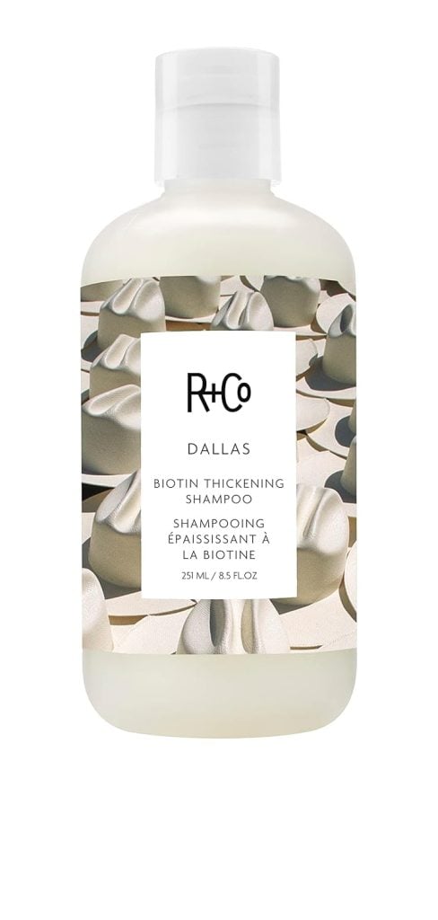 Bottle of R+Co Dallas Biotin Thickening Shampoo, 251 ml, available with fast shipping through Amazon Prime.