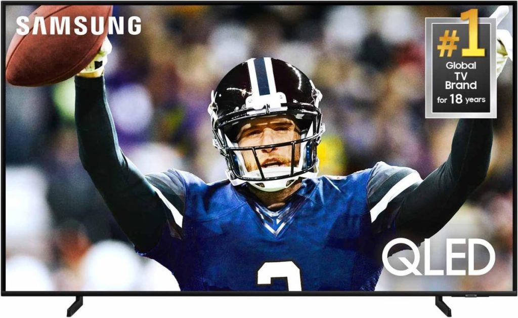 A football player in blue uniform raises his arms in celebration, vividly displayed on a Samsung QLED TV screen. Stream the action seamlessly with Amazon Prime on the #1 global TV brand for 18 years.