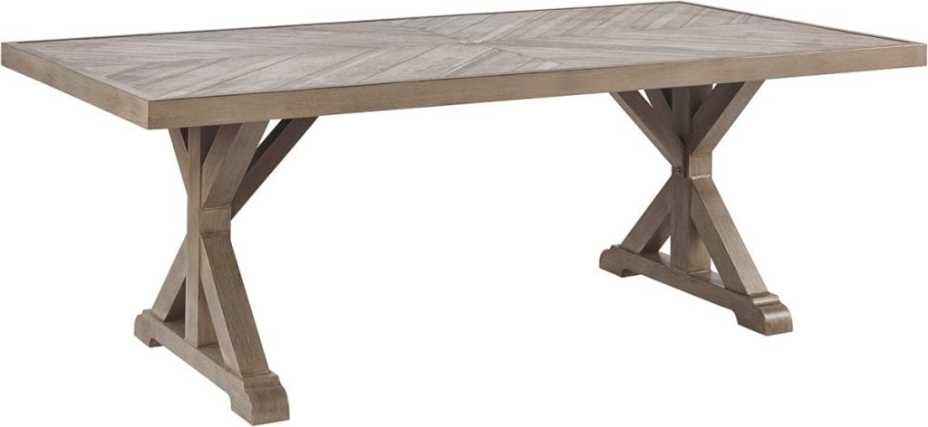 Wooden dining table with a rectangular top and a crossed leg design, perfect for your Airbnb in Waco.