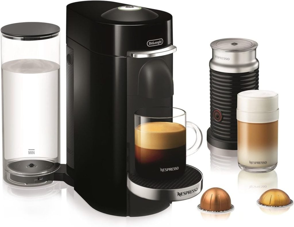 Nespresso coffee machine with water tank, Aeroccino milk frother, and two coffee pods, with an espresso and a latte in glass cups.