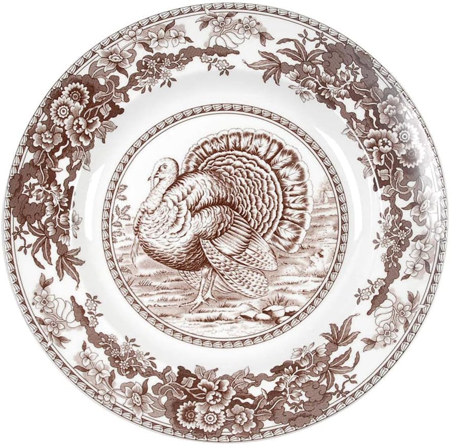 This Thanksgiving plate features a charming brown turkey illustration in the center, elegantly framed by a delicate floral border.