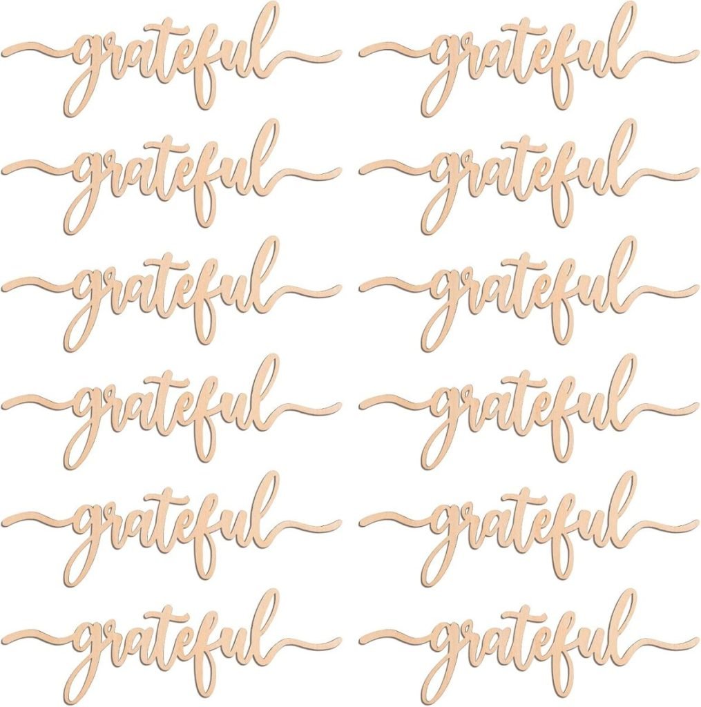 Twelve cutouts of the word "grateful" in cursive, arranged like a beautifully set table of Thanksgiving plates, in four rows and three columns on a white background.