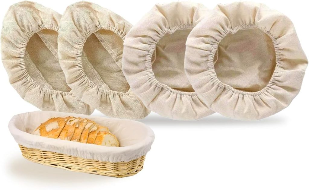 Four round, beige elastic bread bowl covers and one lined rectangular wicker basket containing sliced bread—an inviting setup for anyone learning how to make a sourdough starter at home.