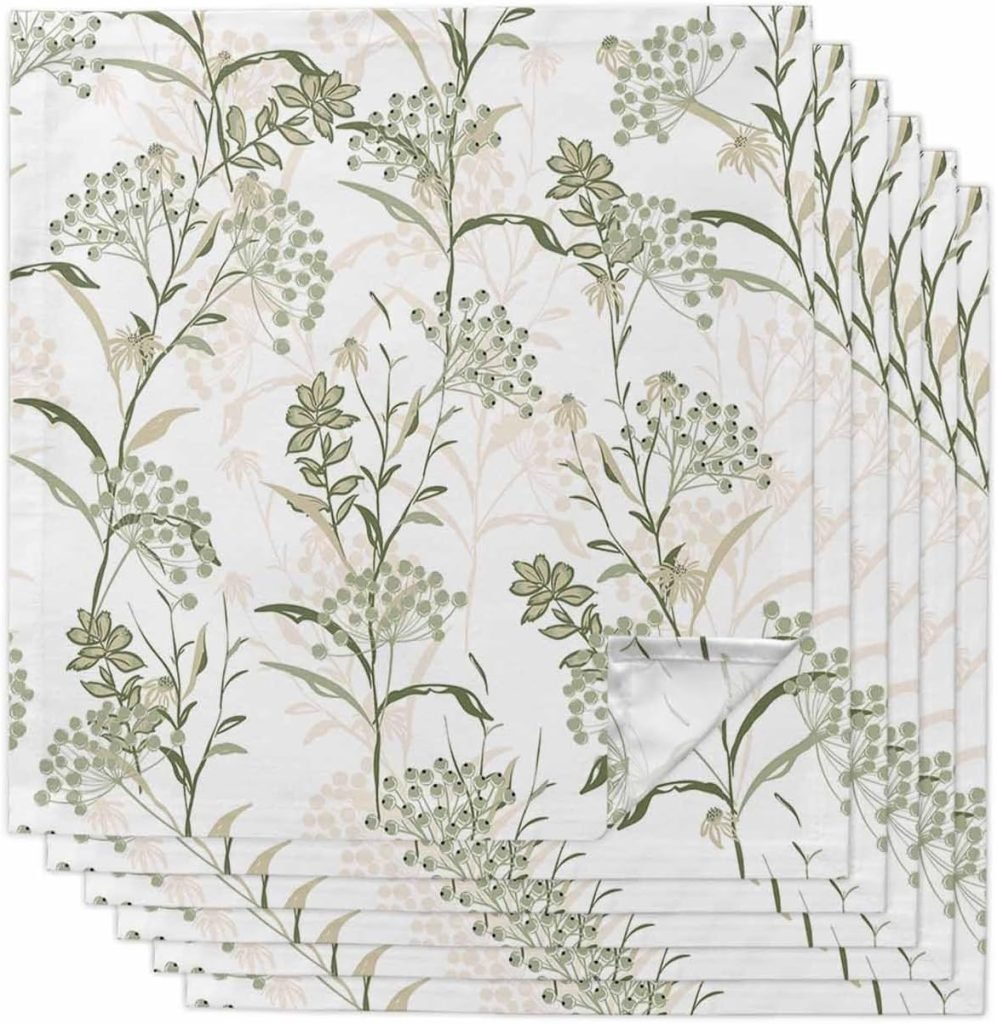 White napkins with green botanical print featuring various sprigs and leaves in a repetitive pattern, perfectly complementing your Thanksgiving plates.