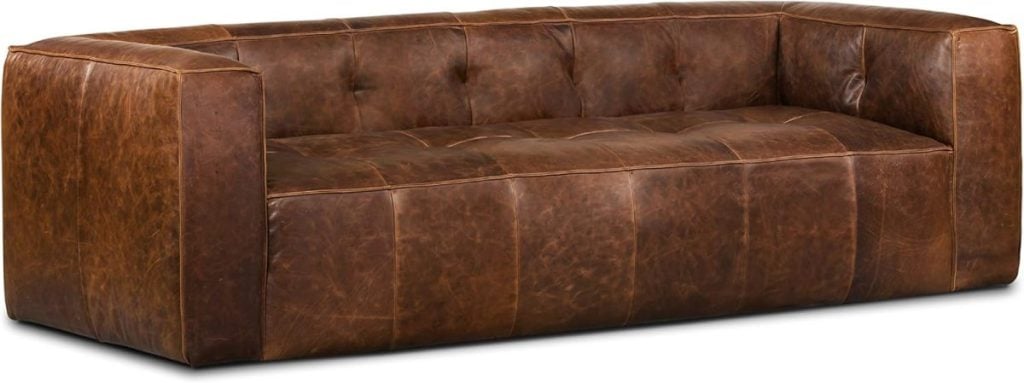 A large brown leather sofa with a tufted backrest and armrests, perfect for enjoying your favorite Amazon Prime series in style and comfort.