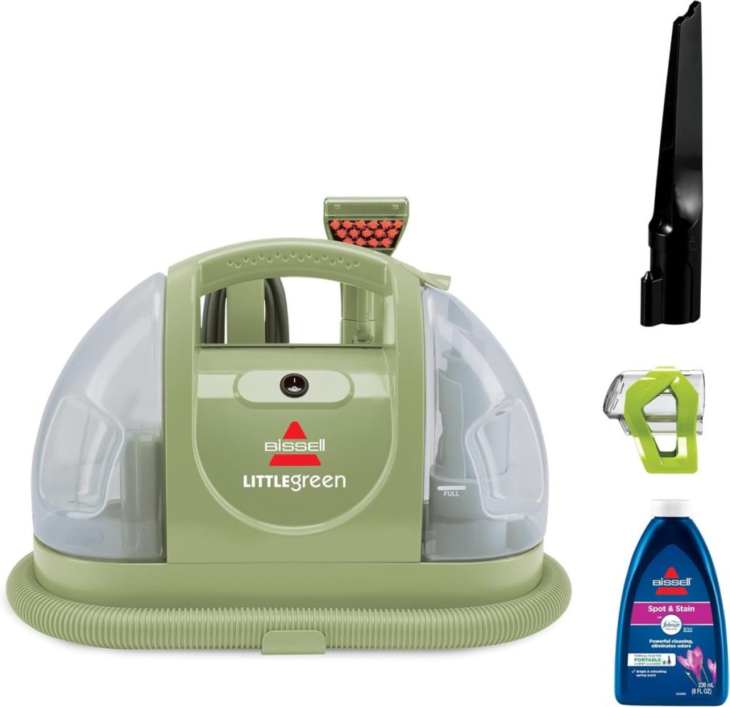 Bissell Little Green portable carpet cleaner, available on Amazon Prime, includes a bottle of cleaning solution, hose attachment, and nozzle.