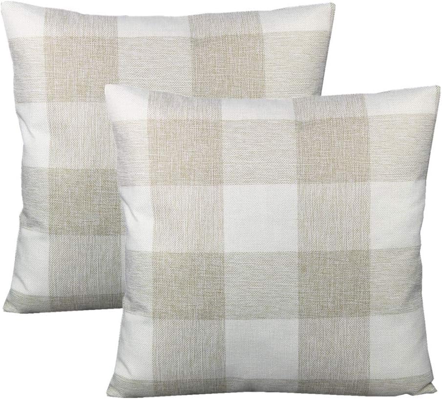 Two beige and white checkered throw pillows are stacked, showing their pattern and texture against a white background.