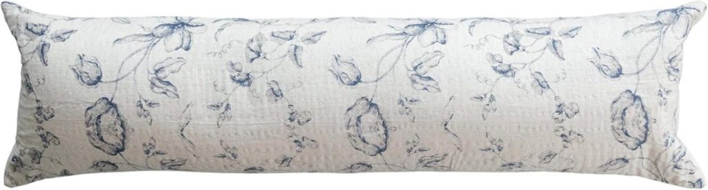 A rectangular body pillow with a white background and blue floral pattern, inspired by Serena and Lily’s signature style.
