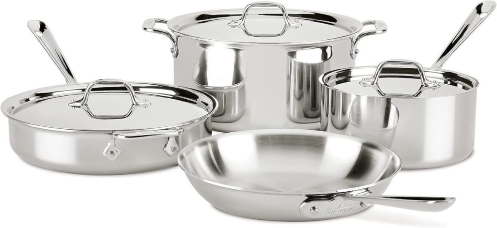 A set of stainless steel cookware available on Amazon Prime includes a stockpot, saucepan, frying pan, and sauté pan, each with handles and lids.