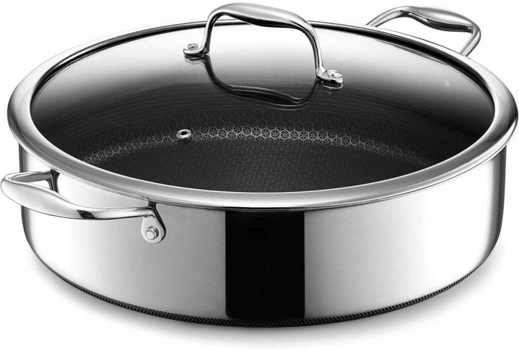 Stainless steel sauté pan with a glass lid and two metal handles, available on Amazon Prime.