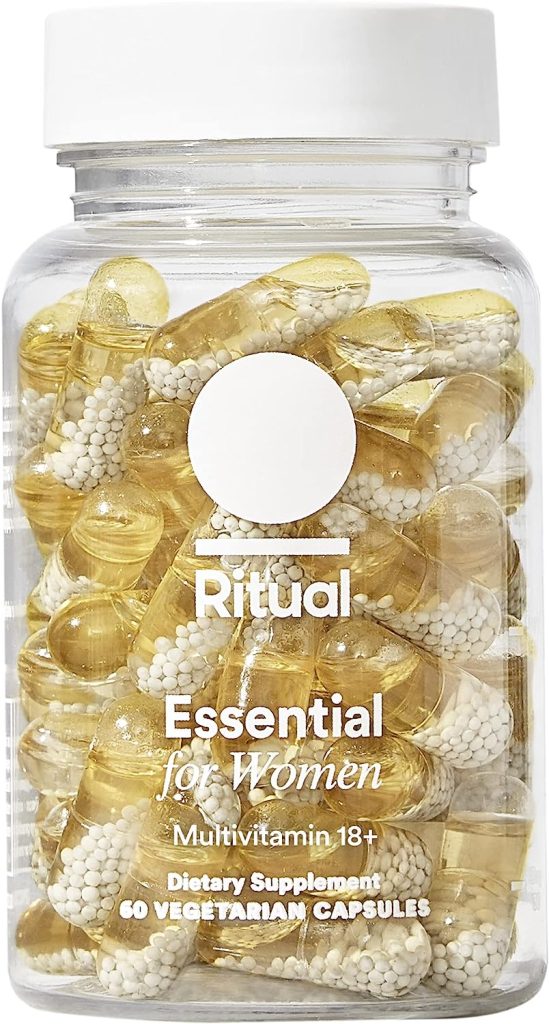 A clear bottle of Ritual Essential for Women multivitamins, available with Amazon Prime, contains 60 vegetarian capsules featuring yellow oil and white beads.