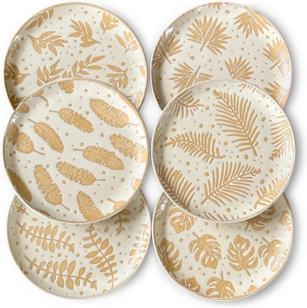 Six ceramic plates with beige botanical leaf patterns on a white background are arranged in two rows, perfect for an elegant Thanksgiving tablescape.