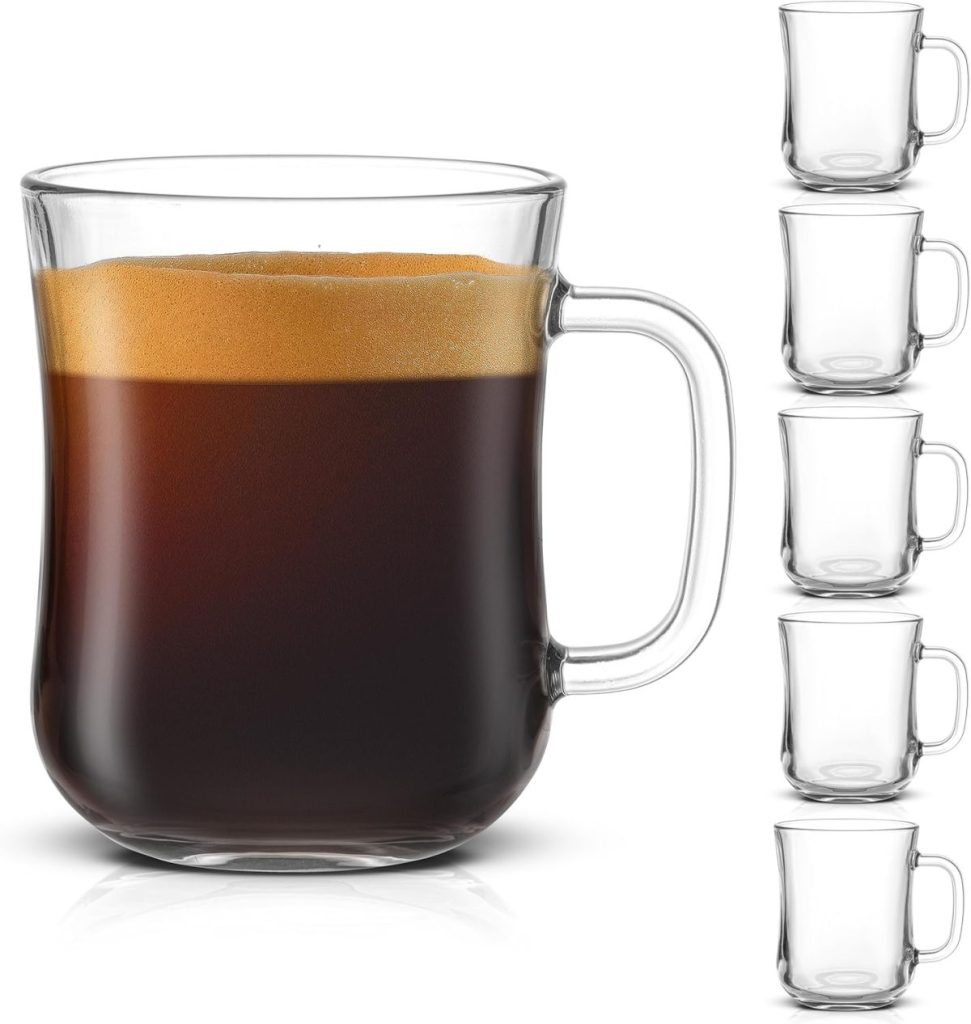 A clear glass mug filled with coffee sits alongside five identical glass mugs stacked vertically, ready for your next brew. Perfect for hosting guests or enjoying a quiet moment, this set is a must-have. Discover convenience and style with easy ordering on Amazon Prime.