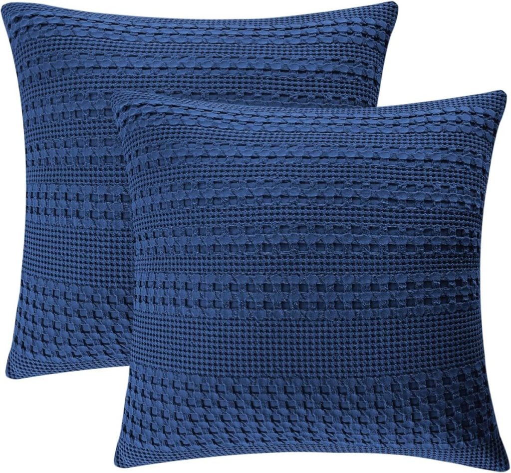 Two blue textured square pillows with a woven pattern, available through Amazon Prime for fast and convenient delivery.