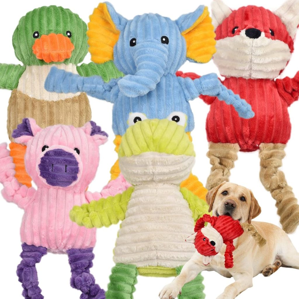 Five colorful plush animal toys and a dog playing with a red fox toy make for an adorable scene, all conveniently available through Amazon Prime.