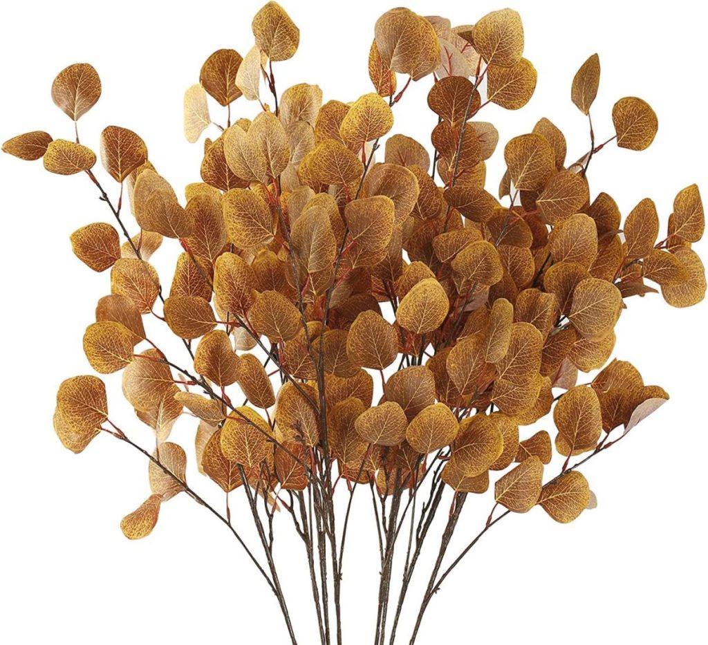 A bundle of artificial eucalyptus stems with round, golden-brown leaves, perfect for adding a touch of autumn to your Pumpkin Craft projects, arranged against a white background.