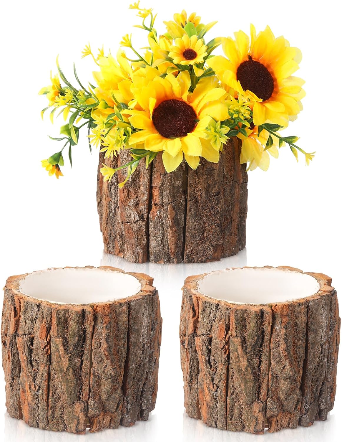 Three rustic, bark-covered planters are shown; one holds artificial yellow sunflowers and greenery, while the other two are empty—perfect for adding natural charm to your Friendsgiving Ideas.