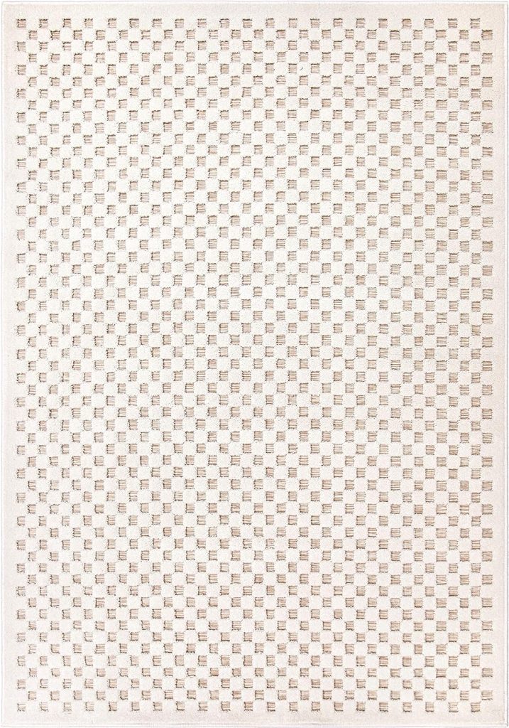 A rectangular rug with a pattern of small, evenly spaced squares in shades of beige and cream.