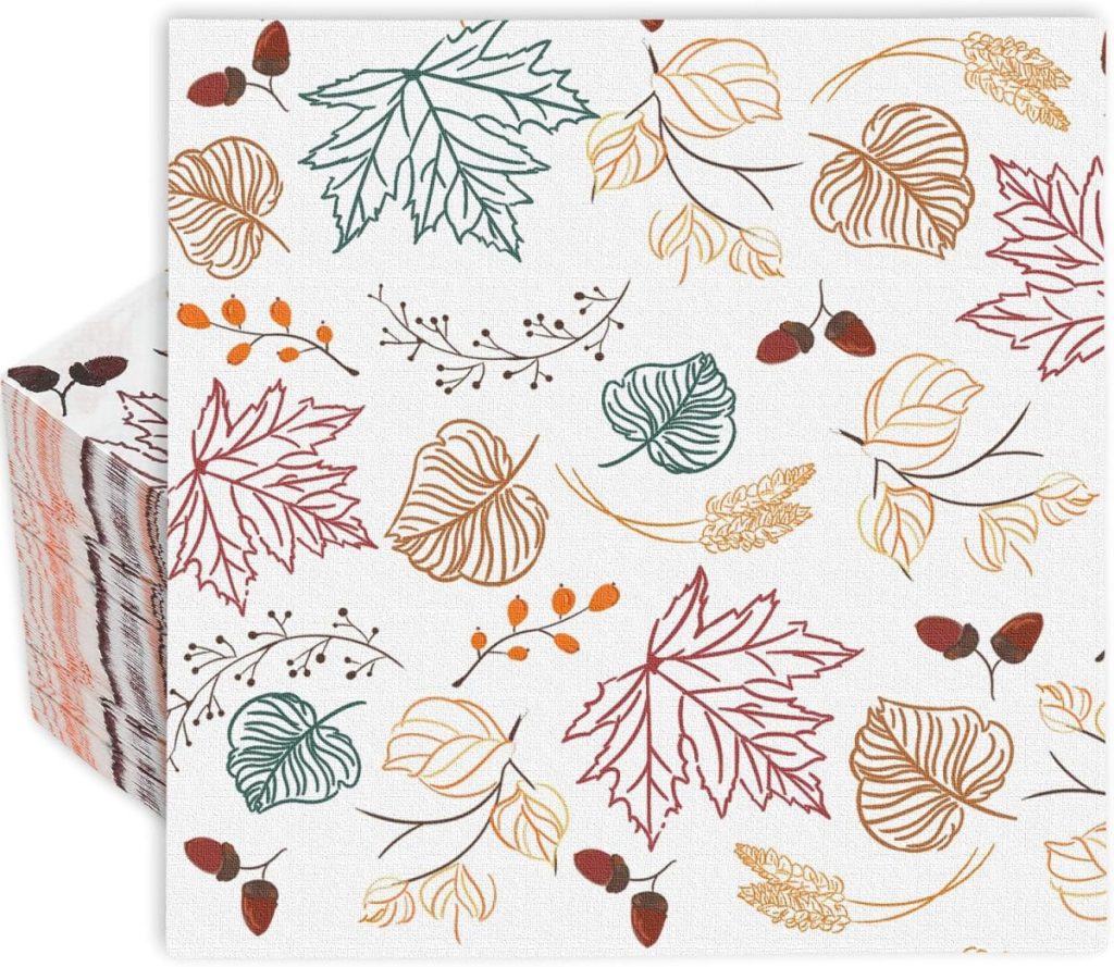 A stack of white napkins decorated with autumn-themed illustrations of leaves, acorns, berries, and pumpkin craft designs in green, orange, brown, and red outlines.