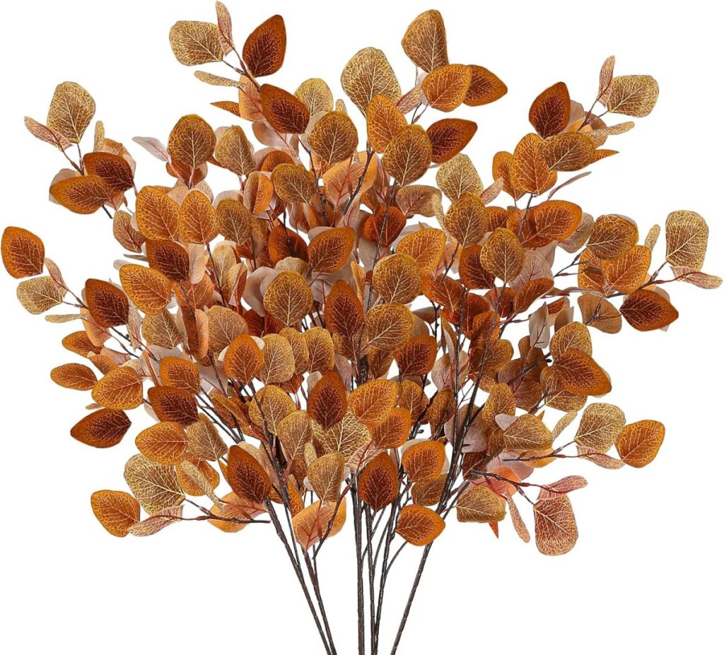 A bunch of artificial autumn leaves in shades of orange, brown, and yellow, arranged on multiple stems—perfect for your next Pumpkin Craft or seasonal decor project.