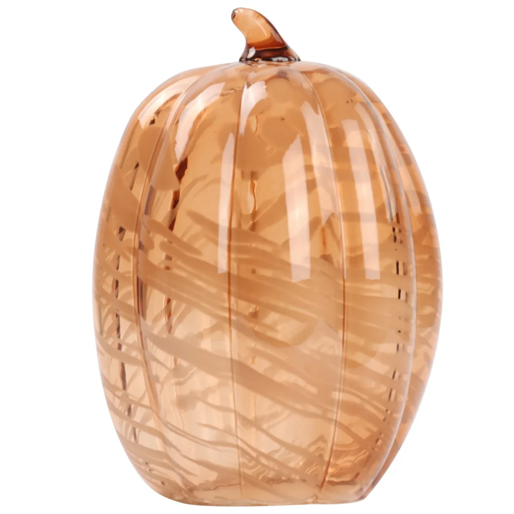 A decorative amber glass pumpkin with a smooth, swirled pattern and a small stem on top.