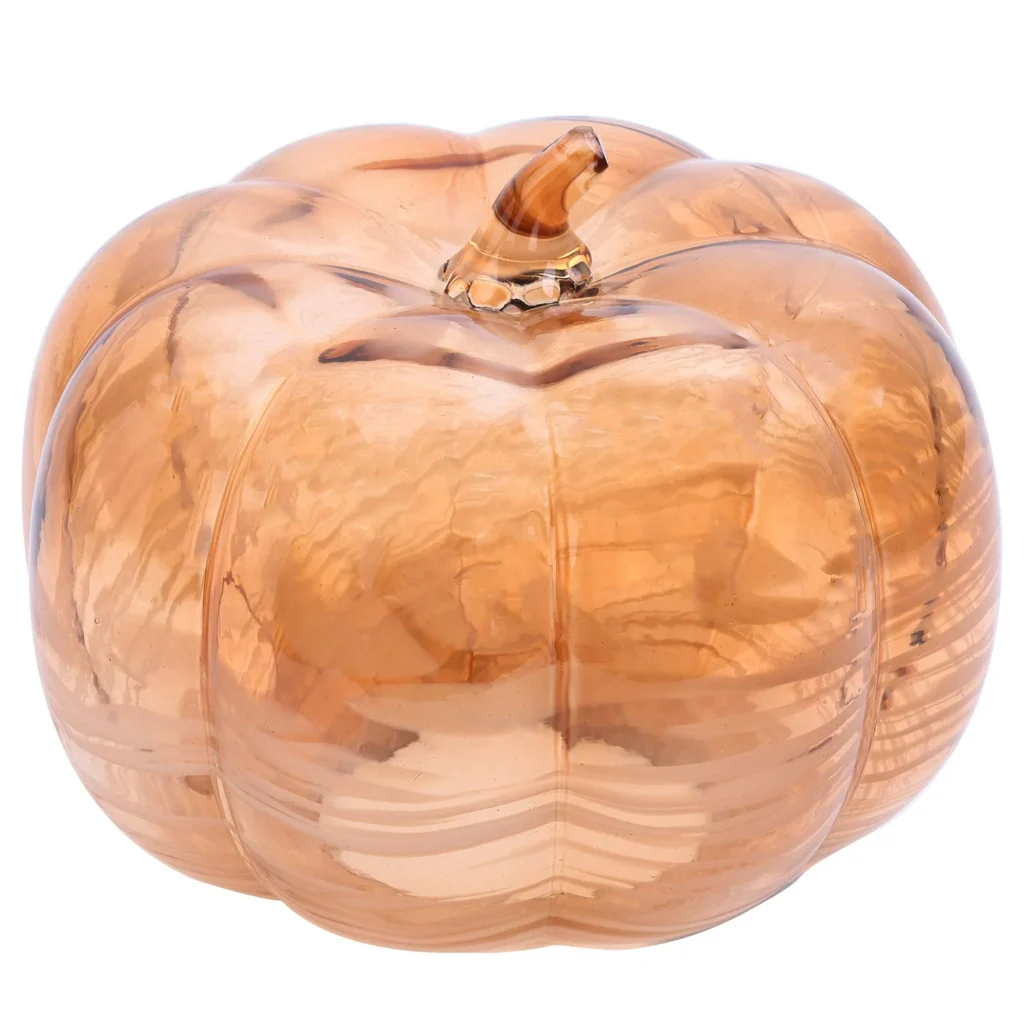 A transparent glass decoration shaped like a pumpkin, with a smooth and reflective surface.