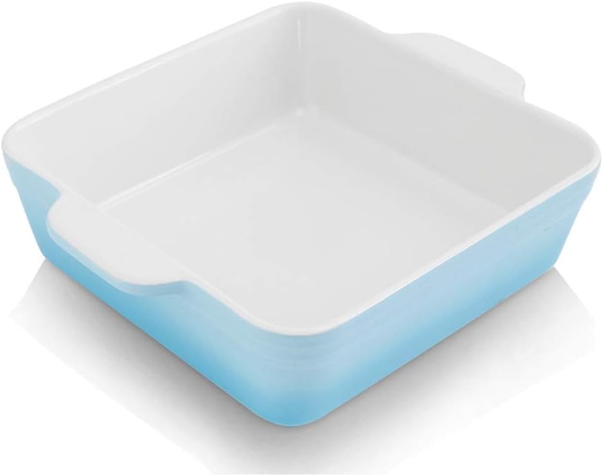 A square blue and white ceramic baking dish with handles, viewed from above at an angle, perfect for serving holiday desserts.