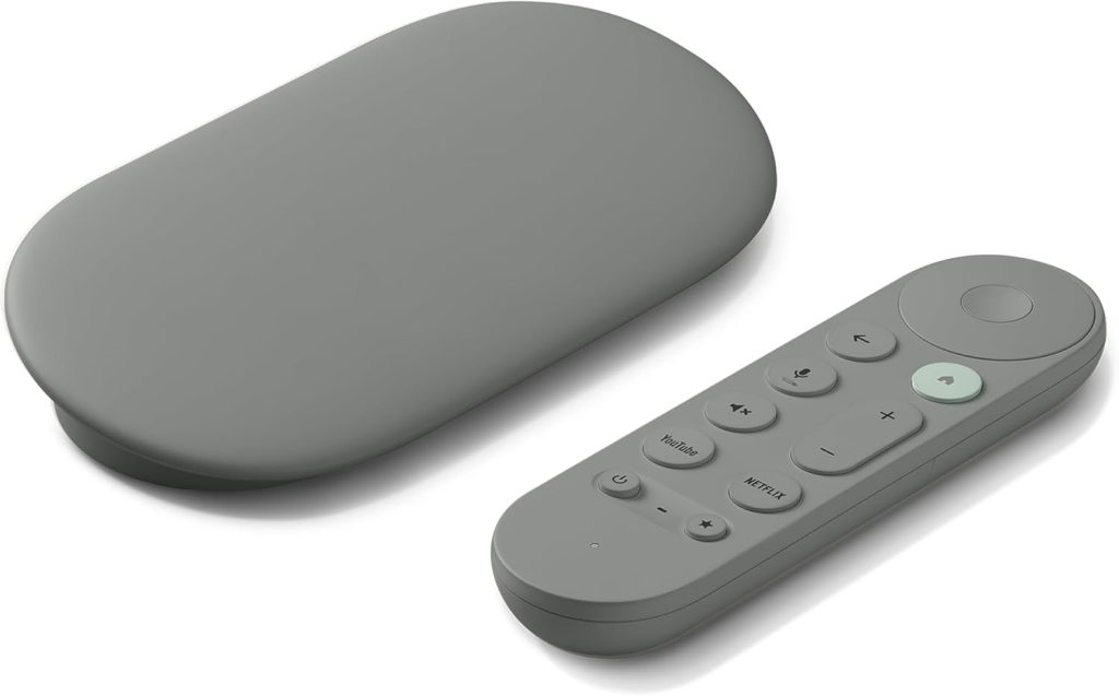 A gray streaming device and matching remote control with dedicated YouTube and Netflix buttons are placed side by side on a white background, perfect for upgrading your home entertainment setup this Black Friday.