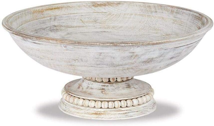 A rustic, round wooden pedestal bowl with whitewashed finish and decorative beads around the base.